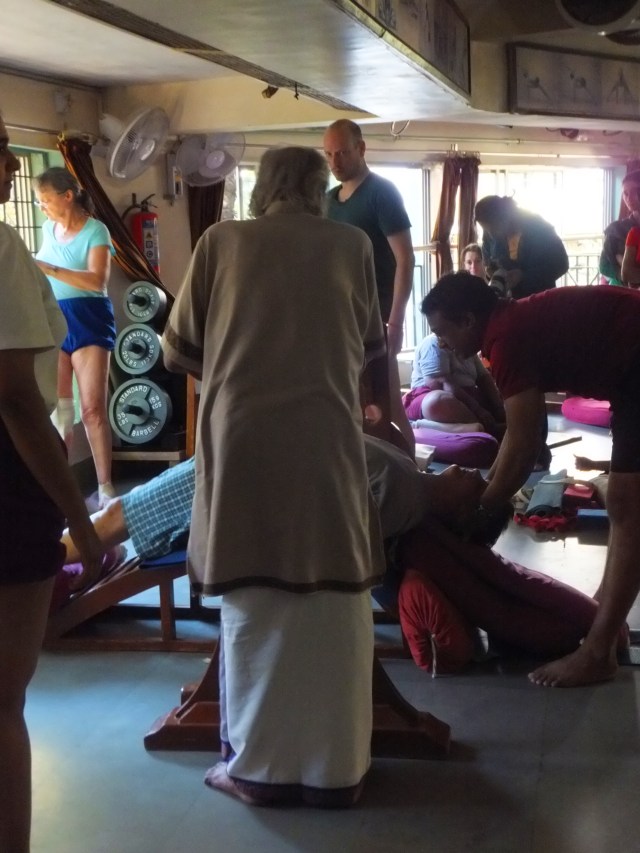 iyengar assisting setu bandha 2